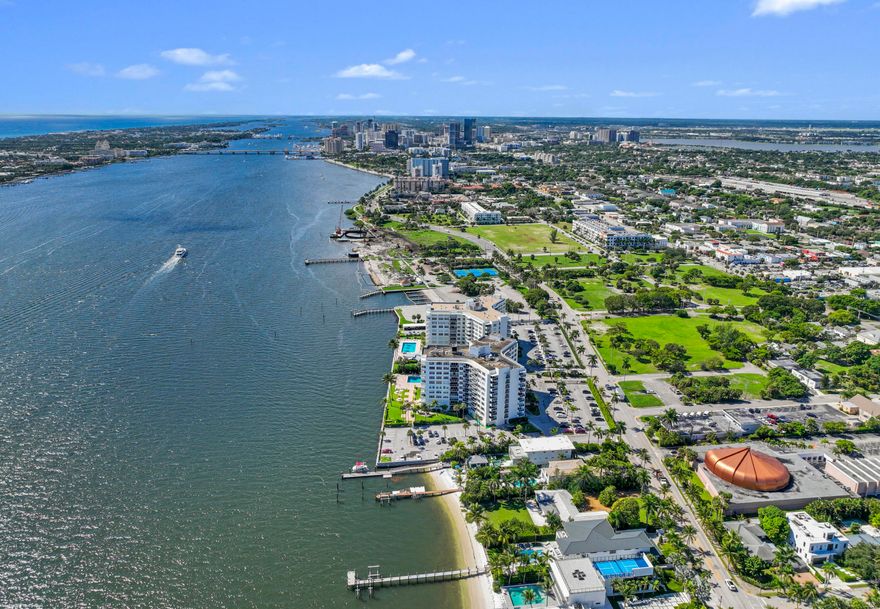 This stunning new direct Intracoastal Oasis was inspired by the incredibly talented minimalist architect Ludwig Mies who was the pioneer of modern architecture. The home's main level has the gourmet kitchen, the living, family and dining rooms all in one open space boasting beautiful views of the wide Intracoastal waterway and Palm Beach. Take the elevator to the third floor where the primary suite has a large deck overlooking the resort style back yard/pool/spa and beachfront. This third level has two additional bedrooms with en-suite baths and great closets. The VIP bedroom and club room are located on the ground floor and live like a separate home. Down at the beach sits a lovely private cabana giving guests the best seat in the house! Behind the entry gates, the air conditioned garage has EV charging stations, lots of storage and an office! 2814 N Flagler Drive is a must see property for those looking to experience elegant beachfront Florida living in downtown West Palm Beach.