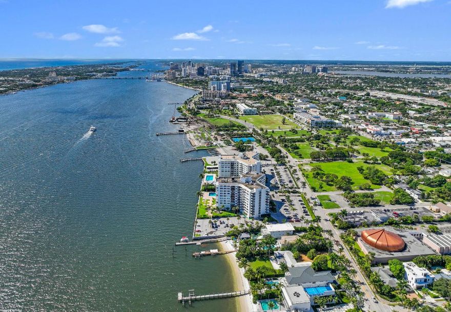 This stunning new direct Intracoastal Oasis was inspired by the incredibly talented minimalist architect Ludwig Mies who was the pioneer of modern architecture. The home's main level has the gourmet kitchen, the living, family and dining rooms all in one open space boasting beautiful views of the wide Intracoastal waterway and Palm Beach. Take the elevator to the third floor where the primary suite has a large deck overlooking the resort style back yard/pool/spa and beachfront. This third level has two additional bedrooms with en-suite baths and great closets. The VIP bedroom and club room are located on the ground floor and live like a separate home. Down at the beach sits a lovely private cabana giving guests the best seat in the house! Behind the entry gates, the air conditioned garage has EV charging stations, lots of storage and an office! 2814 N Flagler Drive is a must see property for those looking to experience elegant beachfront Florida living in downtown West Palm Beach.