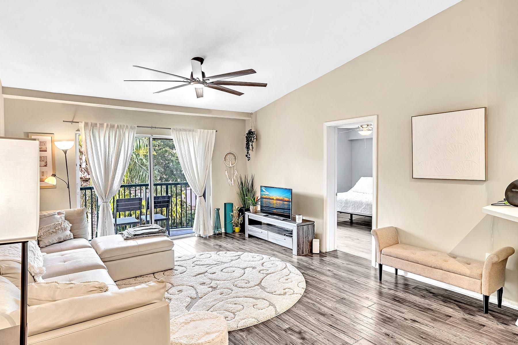 Located east of US1, this beautifully renovated 2/2 unit in the gated community of Village East is close to the beach, airport, downtown, Las Olas, shopping, restaurants and much more. This is a top level unit with Vaulted Ceilings, Walk-in closets, and updates throughout. Updates include light grey hardwood laminate floors in the bedrooms, dark grey floors in the kitchen. One bathroom has been updated with marble on both the floors and in the shower. The second bathroom features a tall sliding glass door and custom shower seat. Replaced both the Air Conditioner & Water heater. This community allows for rentals first year of ownership with a 90-day minimum lease, 2x per year, great for investors or the owner who would like to rent the unit out while not in use