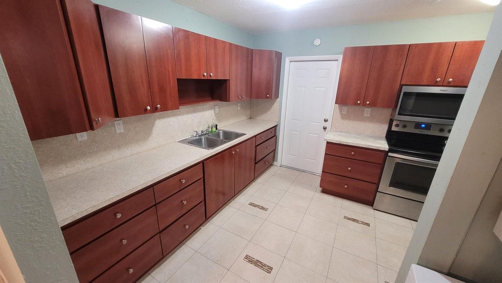 Photo of 857 W 5th Street, Riviera Beach, FL 33404 (MLS # R10980674)