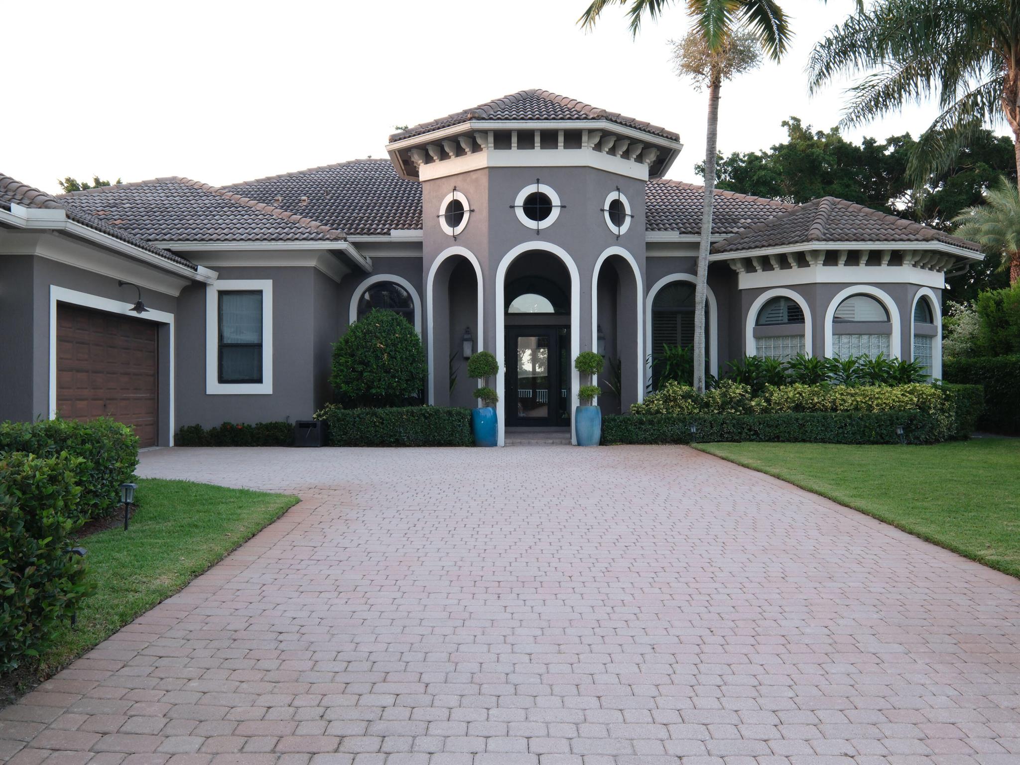 This impeccably styled home is available for custom lease periods. Located in the prestigious Equestrian Club of Wellington on a large lot overlooking the International Polo Club fields, this one-story home features 5 bedrooms, an office, and 4.5 baths. Enjoy high ceilings, open living spaces, and a private backyard oasis with lush landscaping, covered patio, pool, and spa. A 3-car garage offers ample storage. Gated community amenities include a clubhouse, fitness center, tennis courts, and 24-hour manned security.