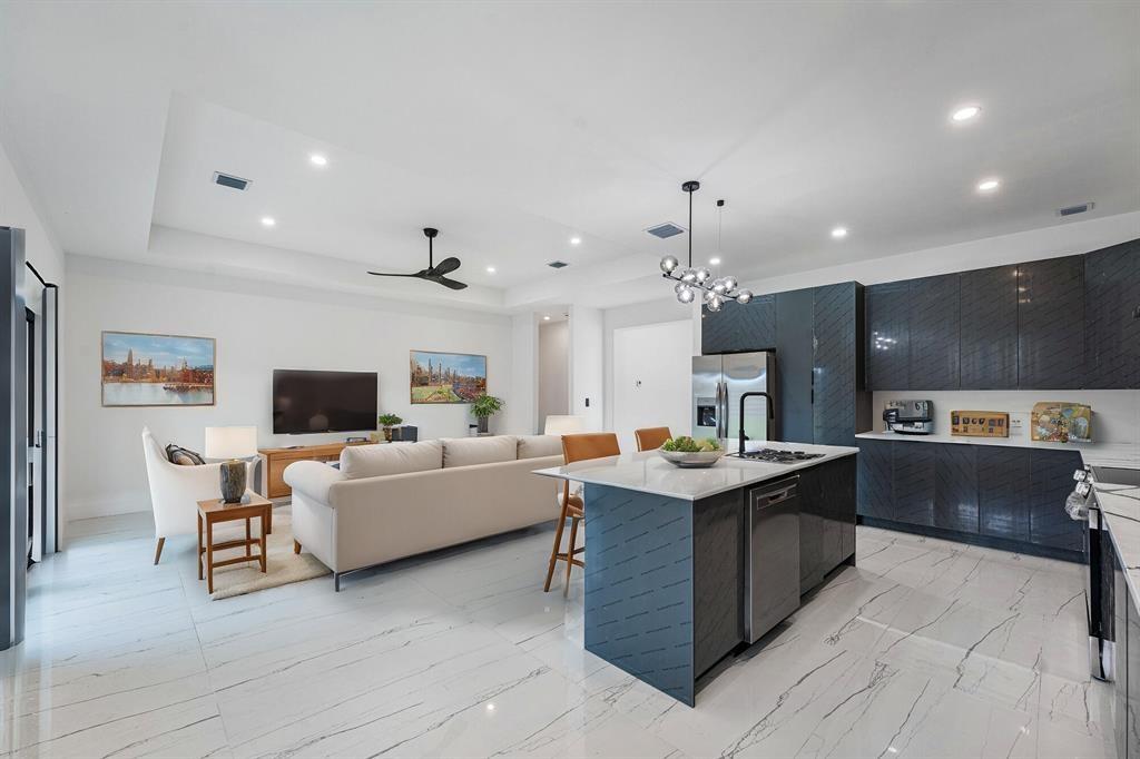 Absolutely beautiful brand-new custom home in of Port St. Lucie's most desirable neighborhoods. With high-impact windows and doors along with elegant porcelain tile flooring throughout, and contemporary LED lighting. This spacious layout includes generously sized bedrooms and a lavish master suite featuring dual walk-in closets and a spa-inspired bathroom with an oversized walk-in shower and much more. NO HOA!! Just minutes from I-95 and just 3 miles from the Turnpike. Expansive yard provides ample space for a pool, RV or boat. Don't miss out on this incredible opportunity! Seller is very motivated!