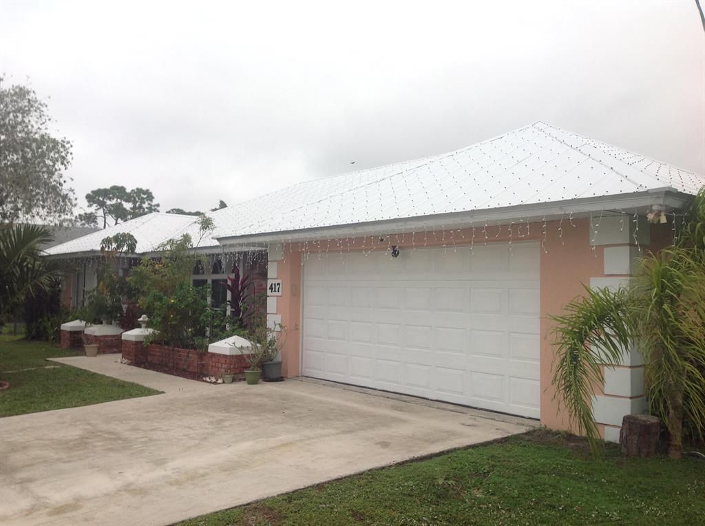 Photo of 417 NE Midvale Street, Port Saint Lucie, FL 34983 (MLS # R10678459)