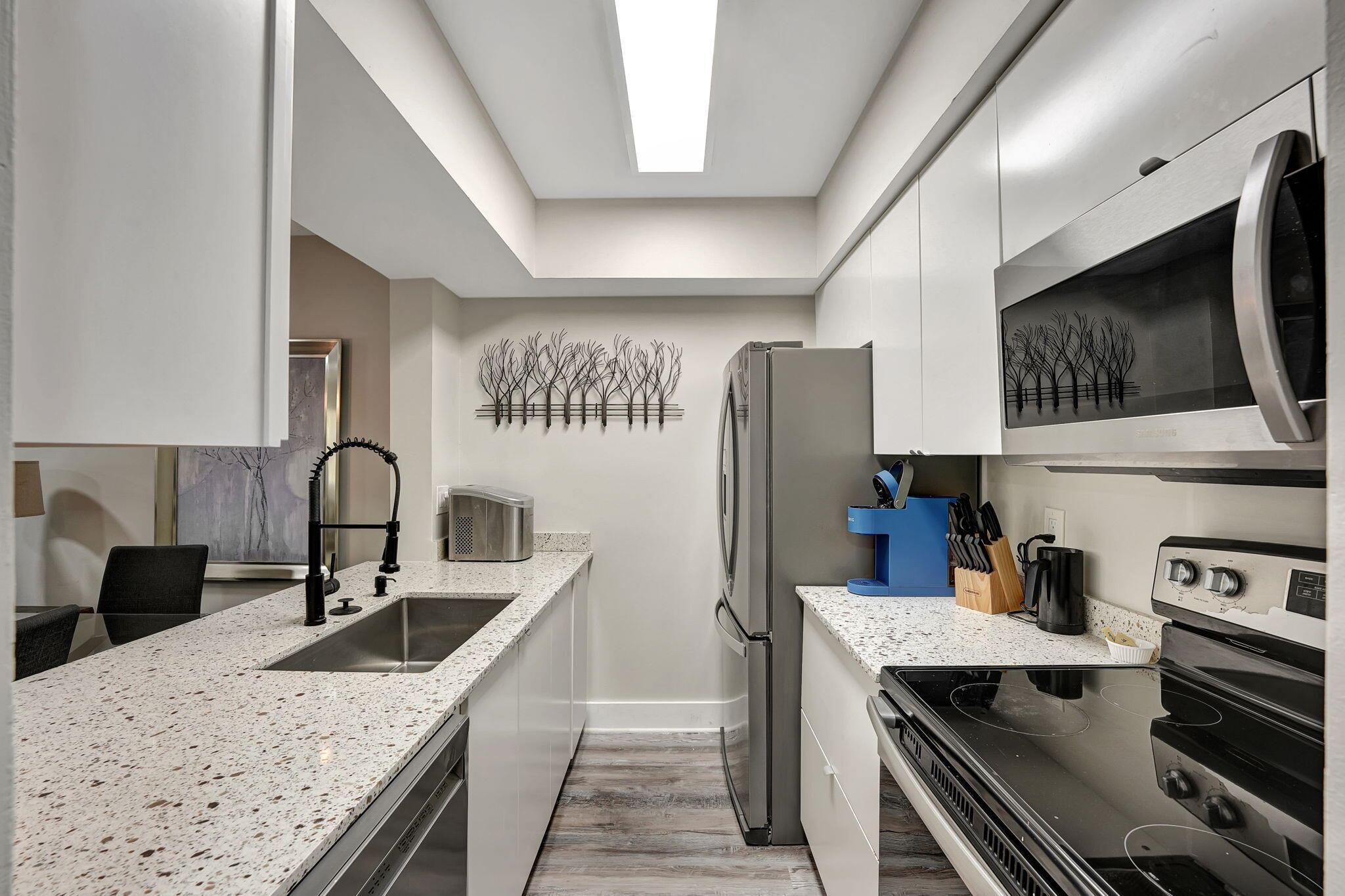 Renovated 1-Bed, 1.5-Bath Condo - Move-In Ready! This beautifully updated condo features an open-concept kitchen, all impact windows, in-unit washer and dryer, and a custom-made walk-in closet. Fully furnished and turnkey, it's perfect for investors or first-time buyers. Includes a storage unit for added convenience. Rent right away!