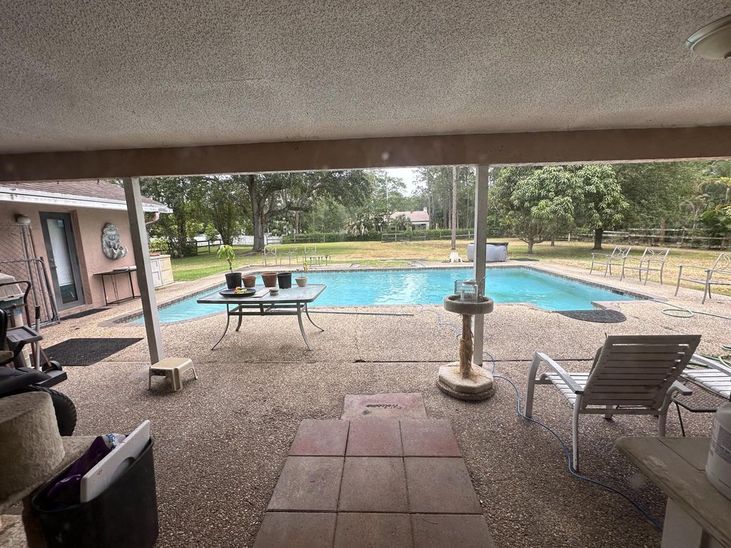 Photo of 5950 NW 66th Way, Parkland, FL 33067 (MLS # R10989004)