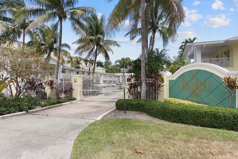 Welcome to the Grove at Wilton Manors.   Location is Everything.  This charming Gated Complex is a short walk to the Vibrant Shops, restaurants and clubs of Wilton Drive.   Association Clubhouse and heated Pool.  Fully Funded Reserves.  New Roof Installed 2024.  Great Unit for Investment or owner occupancy.  Updated Kitchen that offers Granite countertops and stainless Appliances.  A/C and Hot Water Heater Replaced 2023.  Tile Floors installed on angle throughout the entire unit.  Assigned Parking space right at front door.  Pet Friendly Complex allows 2 pets up to 30 lbs each.  Leasing allowed first year of ownership, 2 times per year and 90 day min.