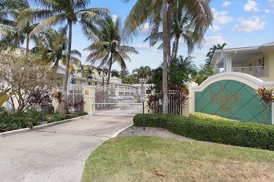 Welcome to the Grove at Wilton Manors.   Location is Everything.  This charming Gated Complex is a short walk to the Vibrant Shops, restaurants and clubs of Wilton Drive.   Association Clubhouse and heated Pool.  Fully Funded Reserves.  New Roof Installed 2024.  Great Unit for Investment or owner occupancy.  Updated Kitchen that offers Granite countertops and stainless Appliances.  A/C and Hot Water Heater Replaced 2023.  Tile Floors installed on angle throughout the entire unit.  Assigned Parking space right at front door.  Pet Friendly Complex allows 2 pets up to 30 lbs each.  Leasing allowed first year of ownership, 2 times per year and 90 day min.
