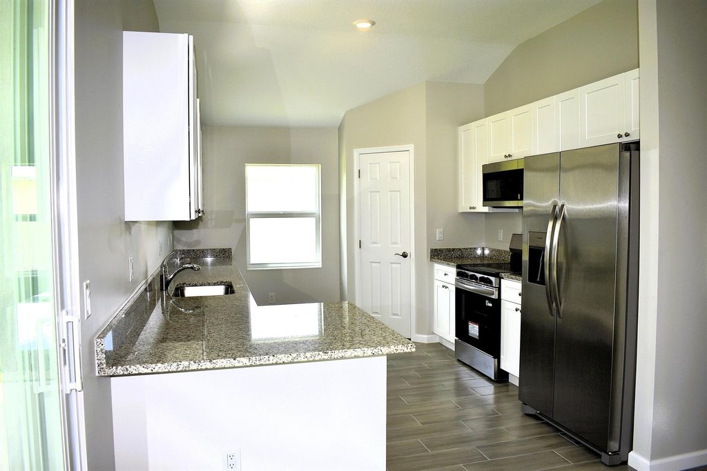 Photo of 3109 SW Curcuma Street, Port Saint Lucie, FL 34953 (MLS # R11119175)