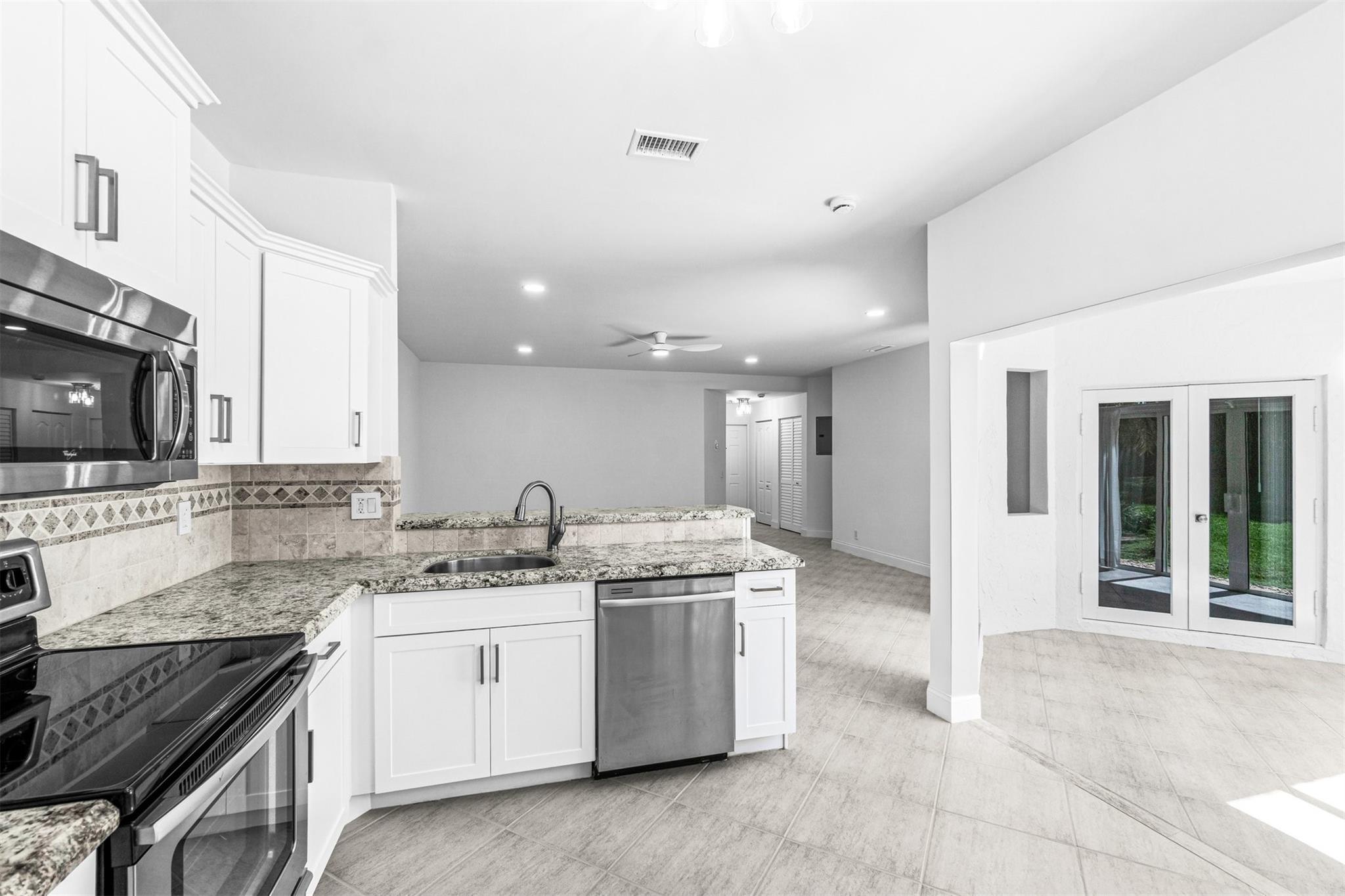 Now Available: Renovated First-Floor Condo in Boca Pointe! All A-Rated School Zone. Welcome to 6510 Via Regina - a beautifully updated 2-bedroom, 2-bath first-floor condo located in the sought-after gated community of Boca Pointe. This light & bright residence features a renovated kitchen with modern cabinetry & stainless-steel appliances, impact glass windows & doors, updated bathrooms, & convenient in-unit washer & dryer. Enjoy peaceful mornings or unwind after a long day in your private backyard patio overlooking a lush garden view, the perfect blend of indoor-outdoor living. Residents have access to a serene lakefront community pool. This move-in ready home offers the ideal blend of comfort, location,& lifestyle. Just minutes to shopping, dining, beaches, & everything Boca has to offer