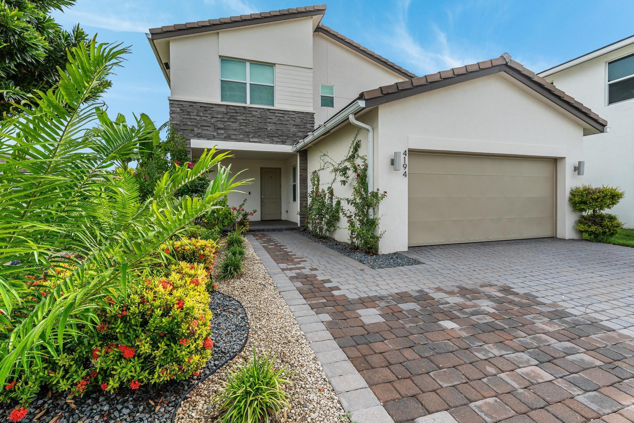 Deluxe Home in Gated, Pet-Friendly Veleiros! Unique Rioja Model is 1 of the rarest & most desirable floorplans on XL Lot. Covered entry opens to foyer & 1st floor bedroom suite, then onto separate dining & great room. Open-plan kitchen w/stainless steel appliances/wall oven+microwave/cooktop+hood, quartz counters+island, pantry & hall to 2-car garage. Covered paver patio opens to sizable yard. Lawnmowing included. Upstairs, master suite spans width of home w/master bath feat. dual sinks & step-in shower + walk-in closet/dressing room. Bright bonus loft perfect for den/home office. Laundry room & 2 more bedrooms + guest bath on 2nd level. Ceramic wood-look tile in living area, LVP in bedrooms, impact windows & sliders, upgraded window treatments/lighting, SmartHome Features. Clubhouse/Pool