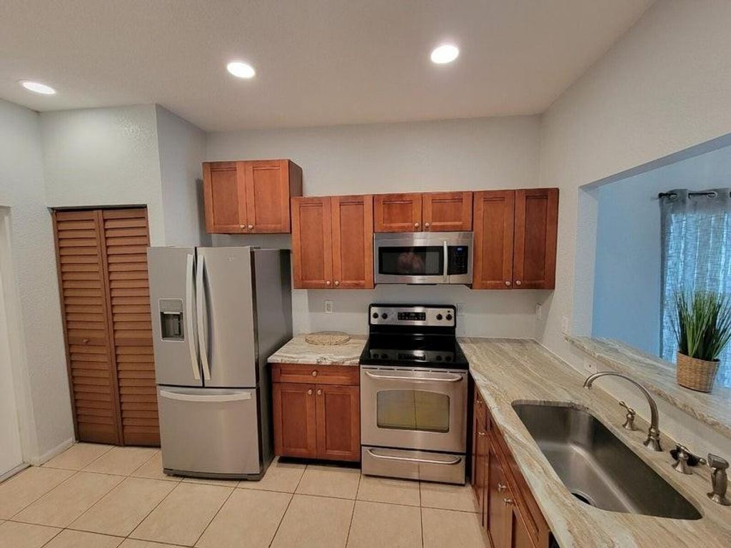 Photo of 197 NW Eller St, Deerfield Beach, FL 33441 (MLS # F10542324)