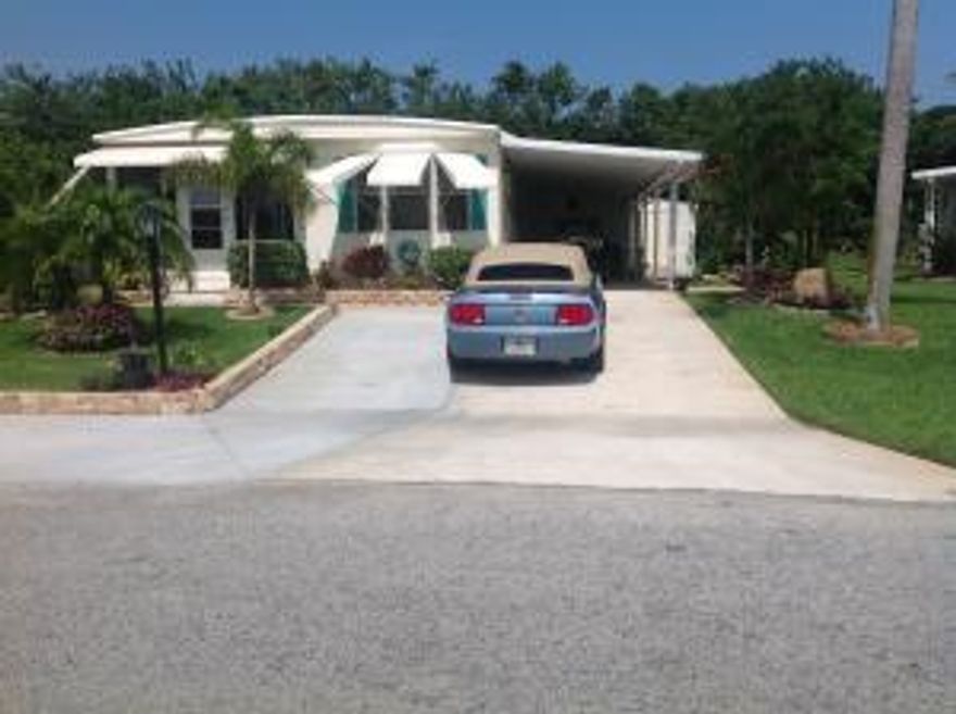 Immaculate & charming doublewide in Cambridge 55+ community. 2 Bedroom/ 2 Bath + front glassed in screen room. Walk in closets.  Oversized lot and additional parking areas added 2014. New 8x10 shed installed 2015 in addition to attached shed (lots of storage). Fenced backyard. New landscaping. New A/C 2010 (serviced yearly), New Metal roof 2005. This home is in Section 1 of Cambridge where you are allowed to have a boat or RV on your property. Minutes to the pristine ocean beaches of Jupiter Island, ICW boat ramp, shopping, restaurants & entertainment. YOU OWN THE LAND - ALL PETS WELCOME.
