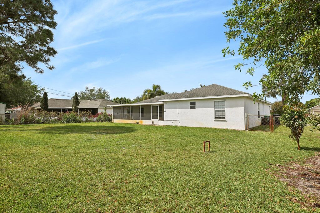 Photo of 3855 SW Kasin Street, Port Saint Lucie, FL 34953 (MLS # R10967101)