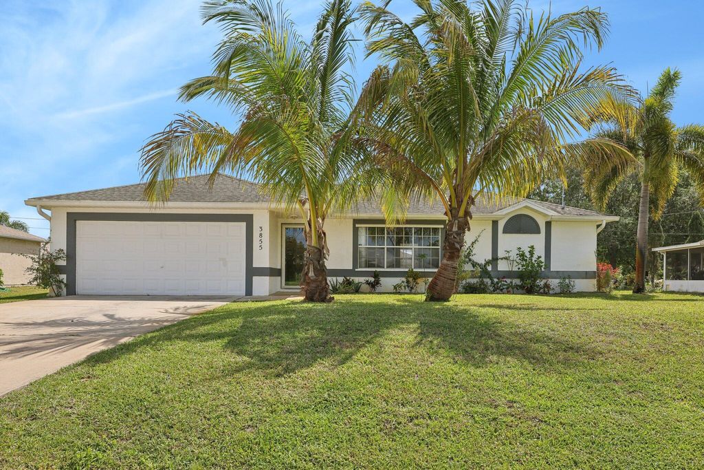 Photo of 3855 SW Kasin Street, Port Saint Lucie, FL 34953 (MLS # R10967101)