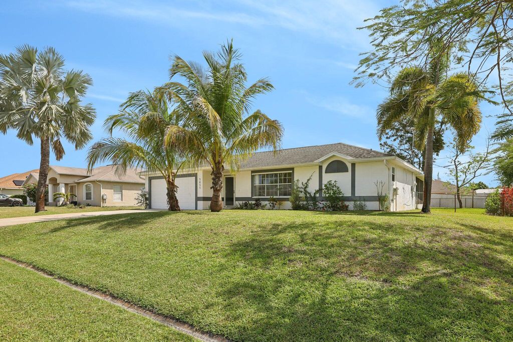Photo of 3855 SW Kasin Street, Port Saint Lucie, FL 34953 (MLS # R10967101)