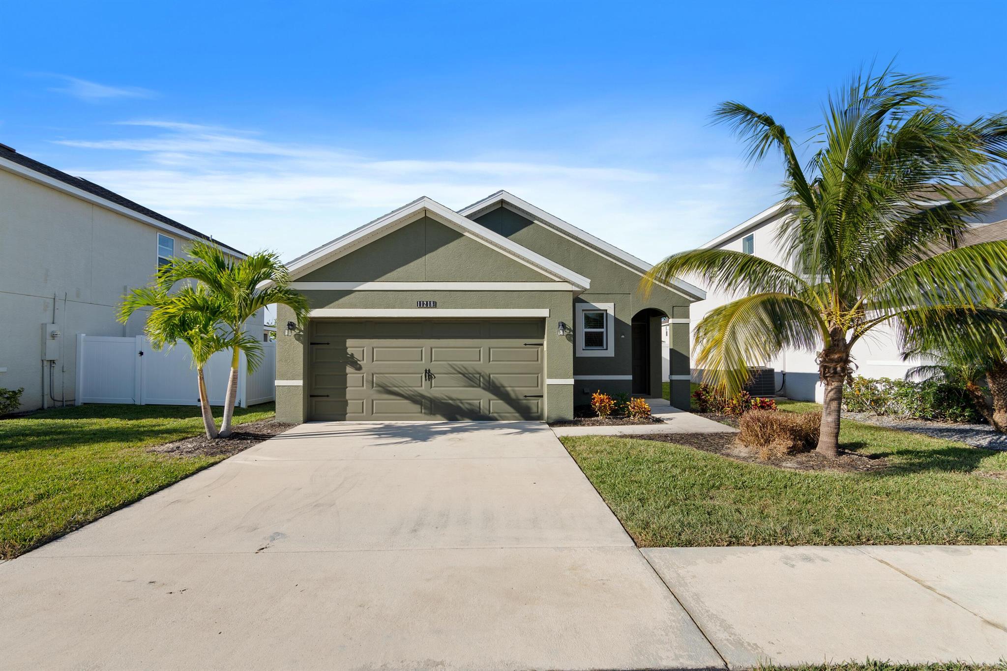 Check out this better than new Allex Model in Victoria Parc Manors. This 3 bedroom 2 bath property with a 2-car garage was just painted inside and out and has Luxury Vinyl Flooring in all living areas. The kitchen features gorgeous dark cabinets and stainless steel appliances. Your master suite is spacious with a walk-in closet and features a bathroom with double sinks and stall shower. There are two additional bedrooms as well as a bathroom with a shower/tub combination. The home also comes with a washer and dryer in the laundry room. Enjoy living near the center of Tradition where shopping, entertainment, and restaurants are all within a short biking or walking distance. In Victoria Parc Manors, your cable, internet, lawn care, exterior pest control and more are included.