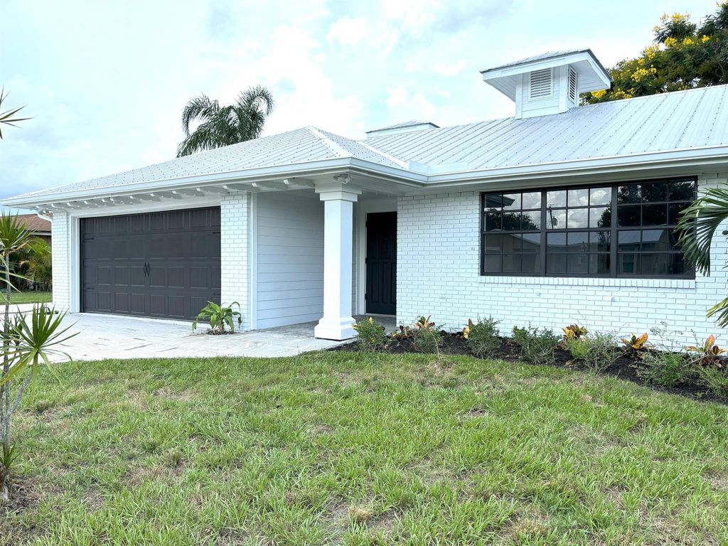 Photo of 733 SE White Avenue, Port Saint Lucie, FL 34983 (MLS # R11012147)