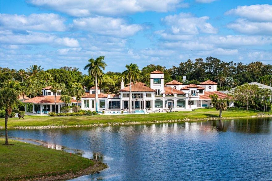 Proudly offered on a premium one acre double lot this stunning estate delivers over 12,000 sq. ft. of refined luxury living with breathtaking wraparound lake and golf course views framed by Florida's signature sunsets in Frenchman's Creek. 
Over the last few years this spectacular home has been fully renovated and modernized while still retaining its majestic charm.  
As you step inside this truly unique renovated estate offering 7 generously sized bedrooms and 8.5 bathrooms, gorgeous marble flooring leads your eye to soaring volume ceilings with stunning wood beams and classic architectural details with walls of windows open to the spectacular views and an abundance of natural light. The luxurious primary suite encompasses the entire east wing of the home serving as a private retreat featuring a spacious sitting area, generous storage with multiple walk-in closets, and a serene spa-like bath with dual vanities, two water closets, separate tub and shower, and tranquil courtyard garden views.

Designed for entertaining, the west wing opens into an impressive entertaining space. The Downsview kitchen is a chef's dream, boasting Miele appliances, Michelangelo marble countertops, and an additional full prep kitchen tucked conveniently around the bend. The airy greenhouse-inspired dining room is the perfect setting for hosting the whole family. Sliders open to wraparound patios, seamlessly blending indoor and outdoor living. Upstairs, a guest suite with private balcony showcases panoramic lake, golf, and sunset views.

Through the private courtyard, discover the two-story guest quarters complete with living room, prep kitchen, two baths, bedroom, and ample storage ideal for hosting extended family or guests in comfort and privacy.

The home also features a nine-seat media room with dry bar and full bath, ensuring every convenience and entertainment option is at hand. With thoughtful design at every turn, this residence offers a seamless balance of luxury living and functional flow, truly a home you may never want to leave.

The outdoor living spaces are equally remarkable, spotlighting a sparkling pool and spa with sun shelf, a putting green, decorative fountain, summer kitchen with pizza oven, and full bar. The luxurious separate guest house provides its own living room, bedroom, and bath, with a wraparound porch that flows into the entertaining areas.

This remarkable residence is more than a home, it is a private sanctuary offering luxury, comfort, and an unmatched lifestyle in one of Palm Beach County's most sought-after communities.

Frenchman's Creek Members enjoy the ultimate concierge lifestyle with resort amenities, state of the art brand new clubhouse, two 18-hole championship golf courses - for only 600 homes, tennis, pickleball, state of the art spa & fitness center, numerous social events and so much more. The exclusive Beach Club, included with membership, located on beautiful Juno Beach allows use of pool, restaurant, beach attendant and events during season.

Call to preview this remarkable residence.