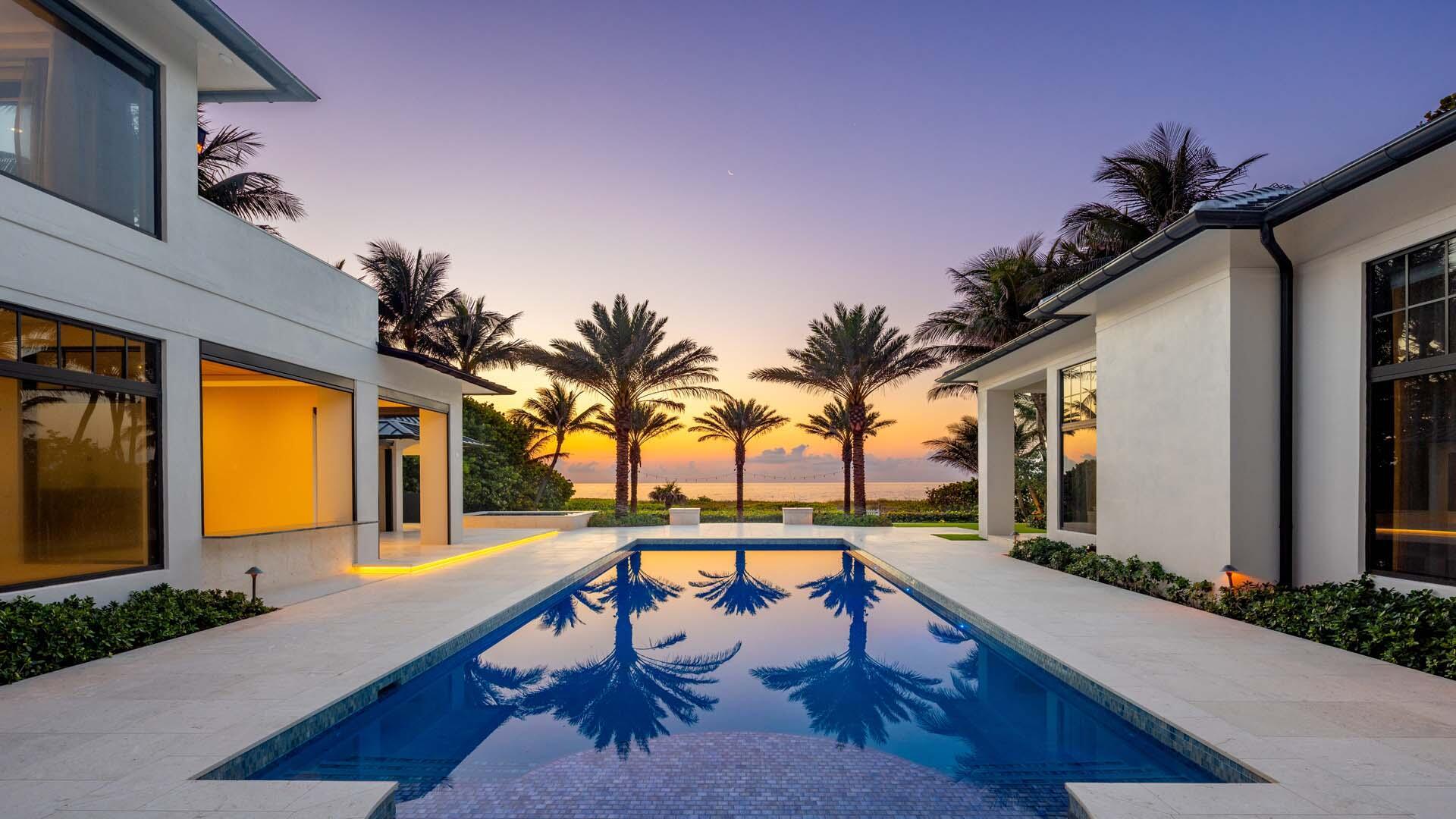 Completely renovated & turnkey oceanfront estate in Delray Beach Estate Section. Designed by Marc Michaels Interiors & renovated by Mouw Associates, this furnished residence sits on an ultra-deep 400'+ lot with unobstructed ocean views. Smart home features, high ceilings, custom lighting, plaster & wall coverings throughout. Chef's kitchen Wolf & Sub-Zero appliances, two islands plus full prep kitchen. Main-level club room, elevator, & designer powder room. Ground-floor primary suite with ocean views, dual baths, fireplace, & large closet. VIP upstairs suite with terrace, fireplace, & wet bar. 7 bedrooms including guest/staff quarters. Resort-style pool, spa, loggia, summer kitchen prep, cabana bath & private beach path. Four-car garage, full smart system, & lush landscape lighting.