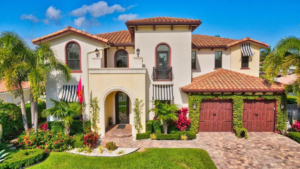 Remarkable Location set in Boca Harbour, This Classic Mediterranean exterior is matched beautifully with a bright and transitional interior, and 80 feet of dock. This home features an award winning great room plan, Impact Windows and Doors, double island kitchen, dry bar, den and large formal dining room. Five full bedrooms including three with water views, an upstairs loft and first floor office. Master suite features huge balcony, spa bath and panoramic views of the intracoastal. Junior master with en suite bath, walk-in closet, Juliet balcony and exceptionally high ceilings. Marble patio with multi-level pool and lush tropical landscaping. Sixty feet of new dock , 22,000 lb boat lift with no fixed bridges and easy ocean access, minutes from downtown Boca Raton and Atlantic Ave! All