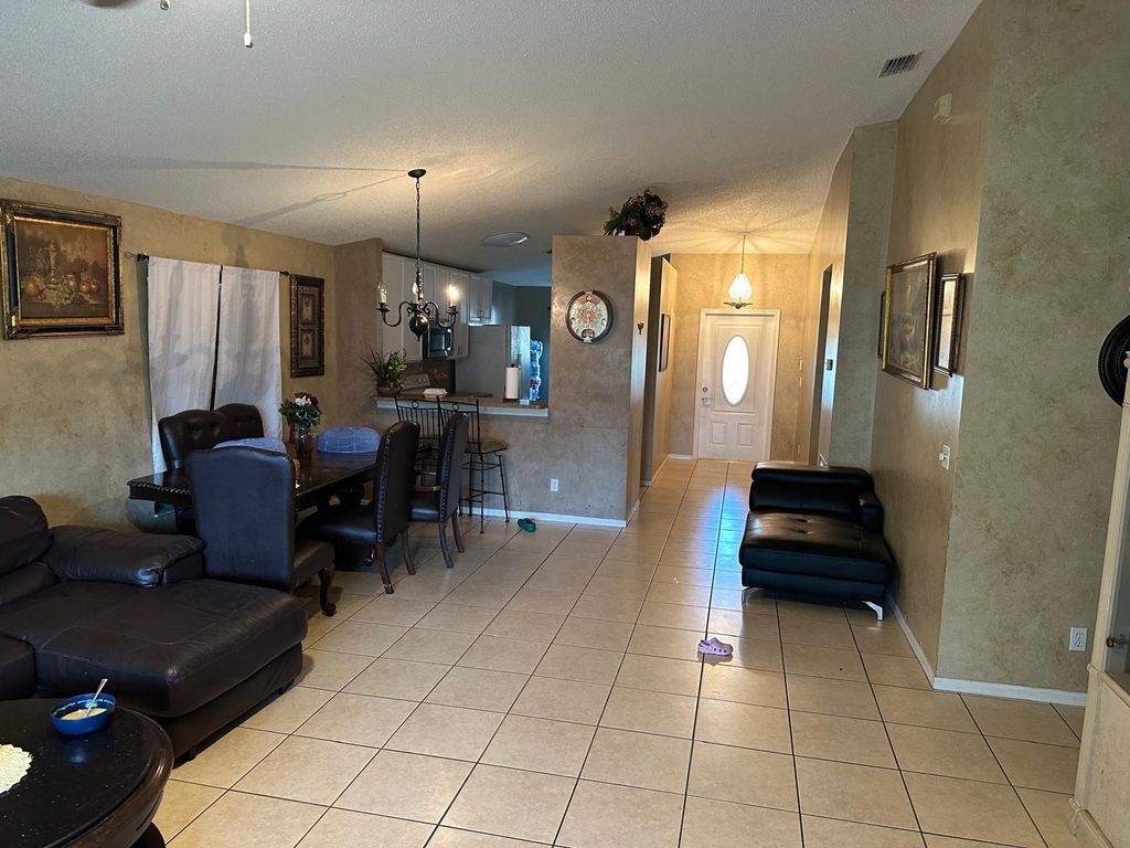 Photo of 628 NW Stanford Ln, Port Saint Lucie, FL 34983 (MLS # F10540846)