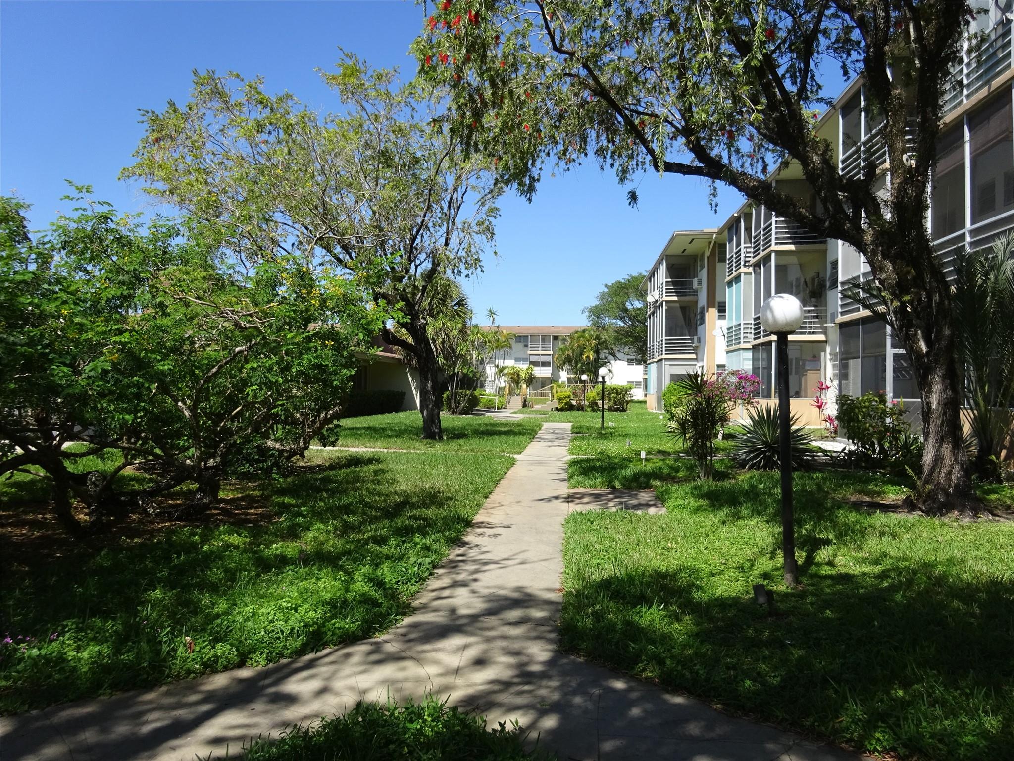 Spacious corner unit in building 11 of Mar-Len-Gardens. Lots of windows for natural light. Enjoy a serene view of the gardens from the large screened balcony with roller shutters for hurricanes protection. Quiet gated community with two pools, clubhouse, gym, billiard room, shuffle board, and so much more! Close to restaurants and stores and only a few miles from the beach.