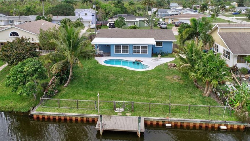 AFFORDABLE OCEAN ACCESS - New Pool 2016, New electric 2017, New tile floors 2017, Remodeled Bathrooms 2018, New Roof 2015, New A/C 2014, Fresh Paint In & Out, High efficiency LED lighting! Park your boat behind your house for quick access to fishing in the St Lucie River or to the ocean for salt-water fishing. Enjoy grilling the fish poolside watching the sunset with your friends & family. Inside shines with Pride of Ownership: Open Floor Plan, Tile Floors, updated kitchen & bathrooms. Florida room expands the 1,488 property appraiser living area to become 1,776 sq ft under air.  Seller states the dock has commercial grade Seawall with 3.5' of water at mean-tide. County Taxes with City water make this home affordable. Don't Miss this Opportunity! Call today! Sizes and Measurements are approximate, Buyer to verify all information please.