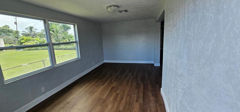 Photo of 540 SW 9th Street, Belle Glade, FL 33430 (MLS # R11113521)