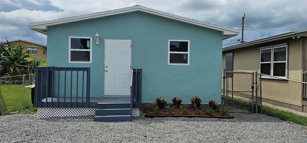 Photo of 540 SW 9th Street, Belle Glade, FL 33430 (MLS # R11113521)