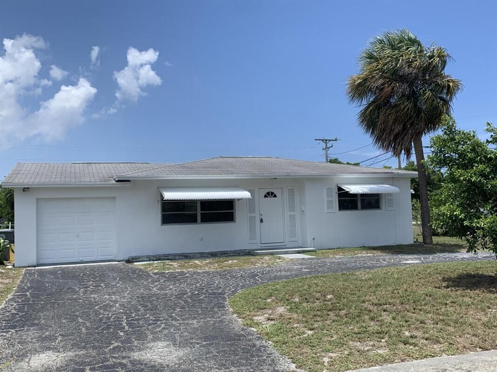 Photo of 707 Greenbriar Drive, Lake Park, FL 33403 (MLS # R10729675)