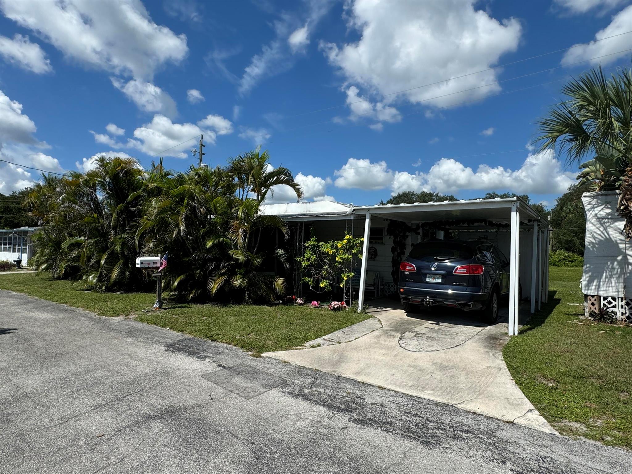 Lovely vintage home with loads of character! New plumbing and roof under 4 yrs, new hot water heater and appliances all under 4 yrs old. Home is fully strapped down including the florida room and shed and carport area. Enjoy the lush landscaping and palms that allow the ocean breezes to blow through! Call me today for a private showing! Over 55 Community within minutes of free beaches and boat launches!