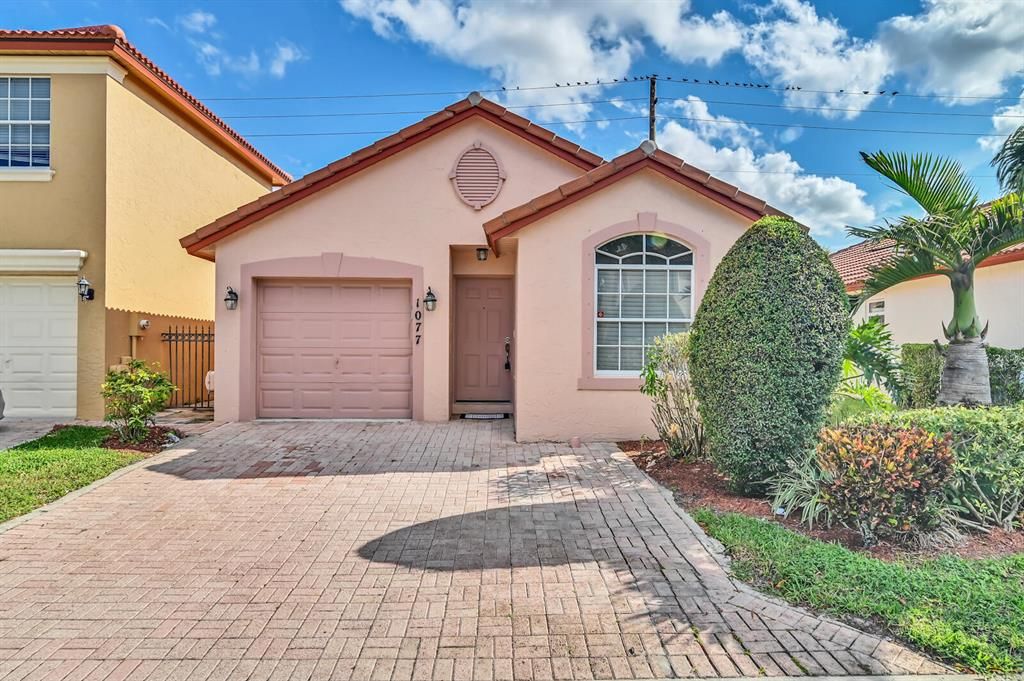 Photo of 1077 Via Jardin, Riviera Beach, FL 33418 (MLS # R10880012)