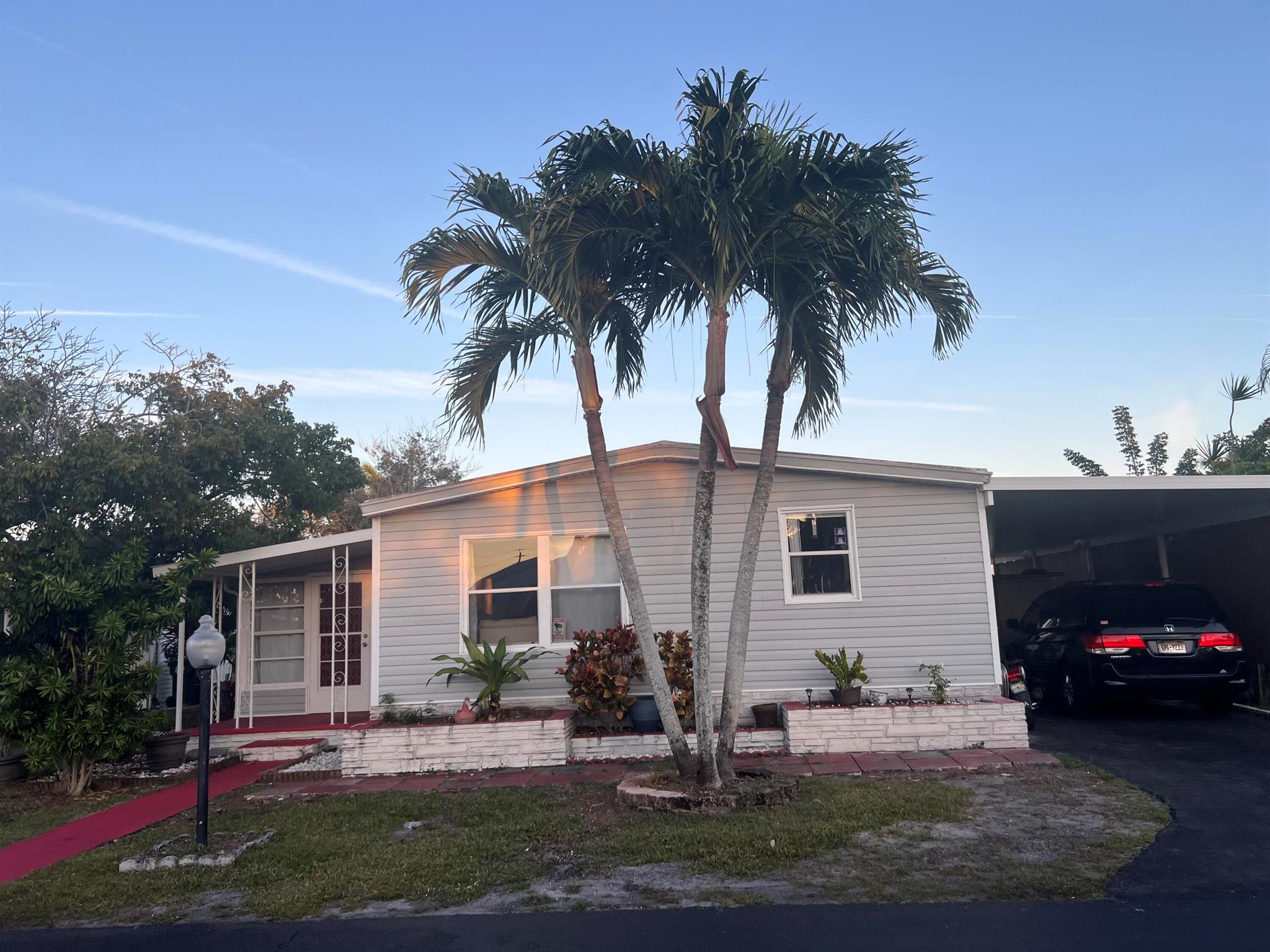 PRICE REDUCED!!!GREAT LOCATION, DO NOT MISS THIS OPPORTUNITY! THIIS IS A 2/2 MOBILE HOME WITH LOTS OF UPDATING, NUMEROUS CABINETS AND STORAGE, 2 SHEDS AND A FLORIDA ROOM CONVERTED INTO A THIRD BEDROOM. WASHER AND DRYER OUTSIDE. LOT RENTAL PER MONTH IS $1,011,WHICH INCLUDES: TRASH REMOVAL, PEST CONTROL, AND WEEKLY LAWN SERVICE.