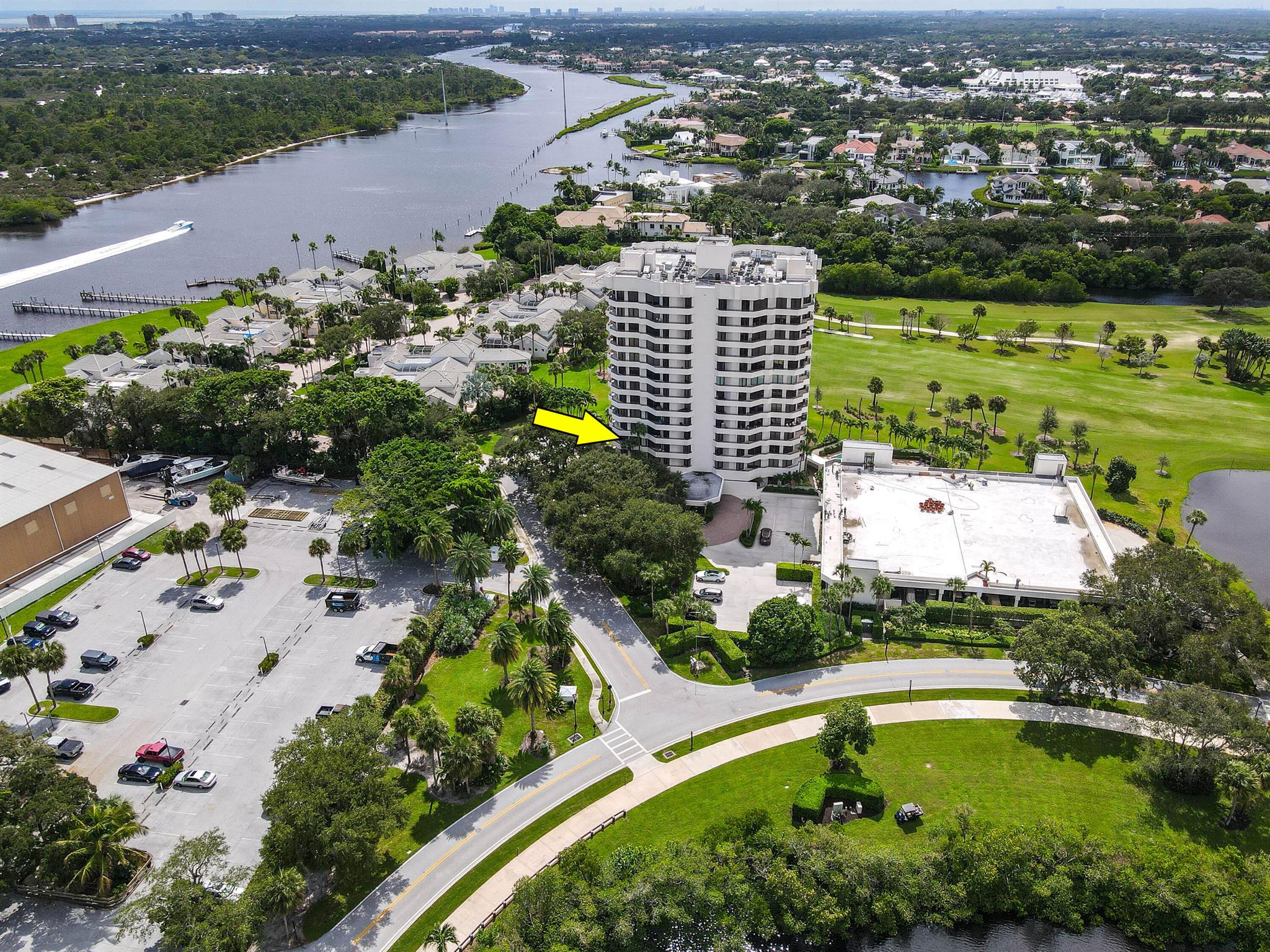 Step into this exquisitely reimagined condo in the prestigious Southporte One Building at Jonathan's Landing, Jupiter, where  luxury meets unparalleled tropical serenity. Perched on the 3rd floor, this 2-bedroom, 2-bathroom residence offers breathtaking, unobstructed views of the lush golf course capturing the essence of South Florida's coveted lifestyle. Fully turnkey, this home has been meticulously redesigned with custom, high-end finishes, including a state-of-the-art kitchen featuring imported cabinetry, premium Thermador appliances, and Calacatta marble countertops. Both bathrooms boast designer vanities with stonework, complemented by white oak plank flooring and plantation shutters.