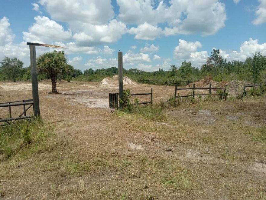 Build or bring your dream home on this spacious 1.50-acre lot. Property is already cleared, fenced with a gate and culvert in place. House pad, extra fill and a retention pond is on the property making it ready to build. The seller has invested over $18,000 in fill. Survey has been done and is available. This lot is just one lot off the paved road. Residents can enjoy the privacy of a rural setting while still being close to essential amenities. The area is a haven for outdoor enthusiasts, boasting attractions like the Kissimmee River Preserve State Park and the expansive Lake Okeechobee, famous for its excellent fishing opportunities. Whether it's fishing, hunting, agriculture, or simply a desire for privacy, Okeechobee County provides an idyllic backdrop to create a personalized retreat