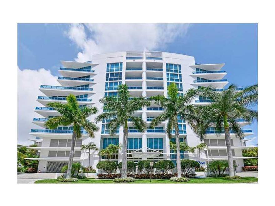 EXQUISITE 3/3.5 CUSTOM CONDO WITH STUNNING HIGH END DESIGNER FINISHES THROUGHOUT! LOCATED ON A HIGH FLOOR ON THE NE CORNER OF THIS UNIQUE CONTEMPORARY BOUTIQUE BUILDING - ENJOY AMAZING ENTERTAINING SPACE & BREATH TAKING VIEWS!  FULLY EQUIPT OPEN KITCHEN W /DOUBLE OVEN & WINE REFRIG - FINISHED IN UNIQUE GRANITE & STAINLESS STEEL!  ENORMOUS MASTER SUITE W/2 WALK IN CLOSETS!  SPA LIKE MASTER BATH!  2 GARAGE PARKING SPACES AND EXTRA STORAGE!  MANY BUILDING AMENITIES INCLUDING A FULL GYM, POOL AND MUCH MORE!