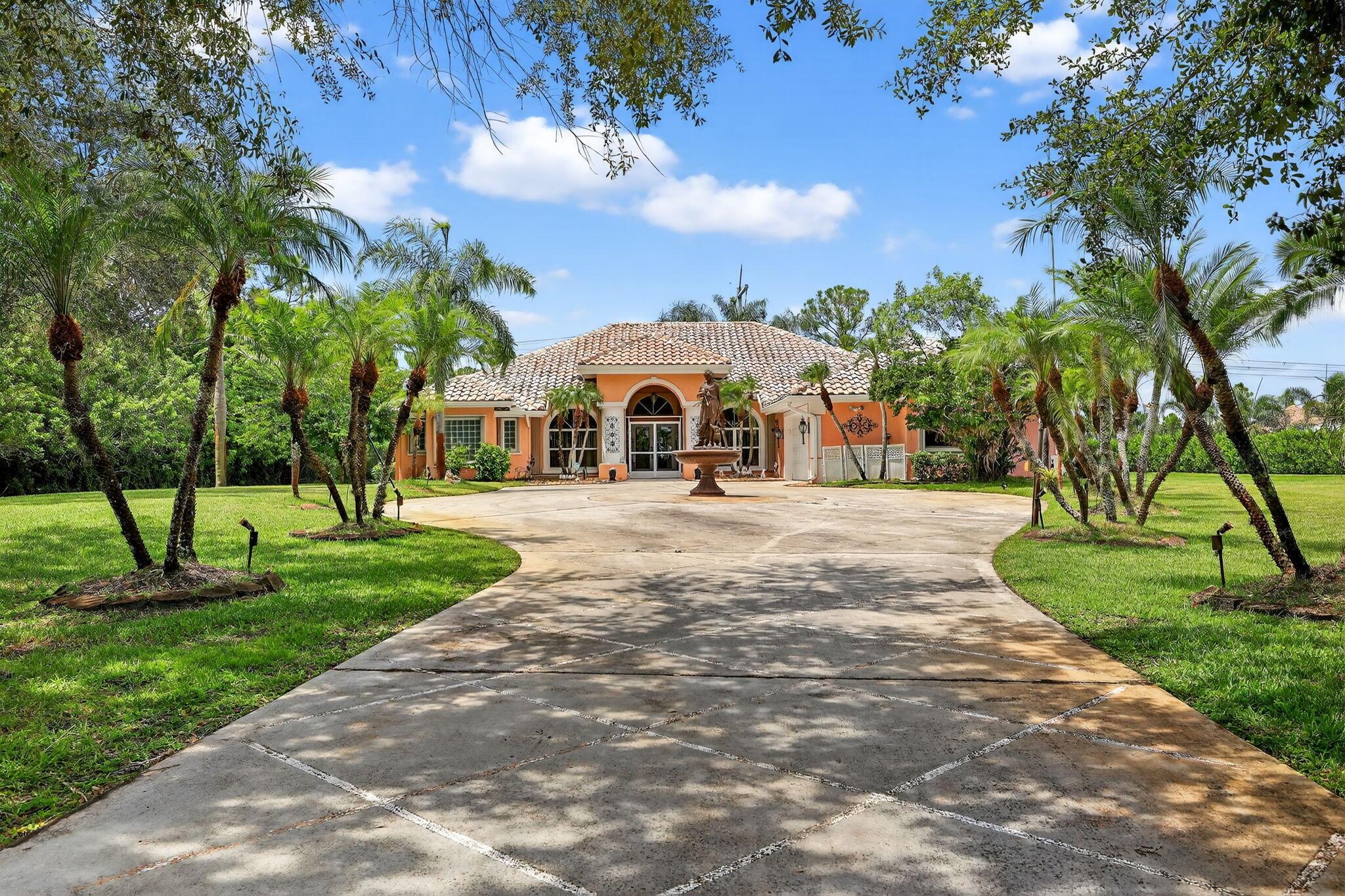 Located in the exclusive Sable Creek subdivision of PGA Village... A rare opportunity to own a 3-bedroom, 3-bath CBS pool home situated on over 4.3 ACRES in one of PGA Village's most prestigious enclaves, surrounded by multi-million-dollar estates. This property boasts a BRAND-NEW METAL ROOF being installed this month! The spacious open floor plan includes a formal living room, dining room, family room, and an eat-in kitchen, perfect for both everyday living and entertaining. The owner's suite features elegant coffered ceilings, a beautifully updated bath, and a massive walk-in closet along with an additional walk-in for ample storage. Multiple sets of sliding glass doors open to a large covered and screened patio, overlooking the sparkling pool,spa,and pergola creating a private retreat