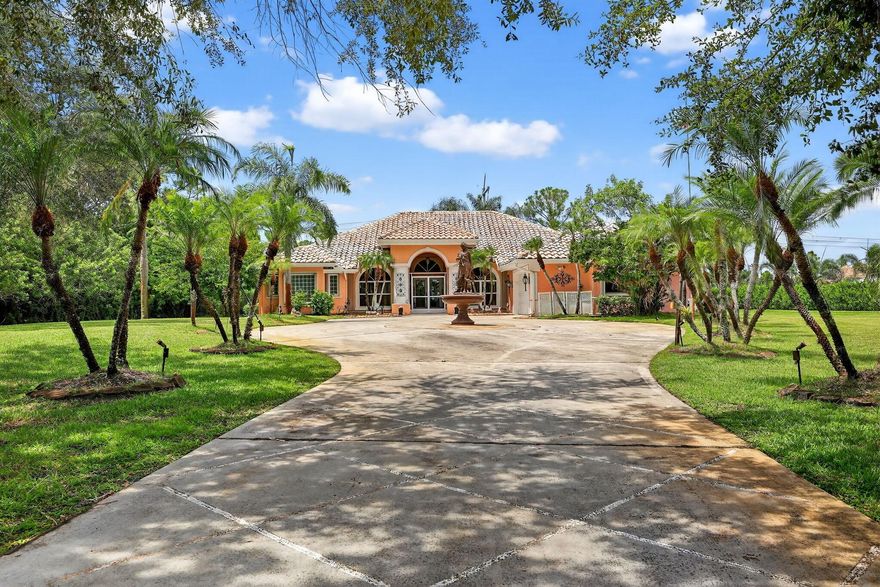Located in the exclusive Sable Creek subdivision of PGA Village... A rare opportunity to own a 3-bedroom, 3-bath CBS pool home situated on over 4.3 ACRES  in one of PGA Village's most prestigious enclaves, surrounded by multi-million-dollar estates. This property boasts a BRAND-NEW METAL ROOF being installed this month! The spacious open floor plan includes a formal living room, dining room, family room, and an eat-in kitchen, perfect for both everyday living and entertaining. The owner's suite features elegant coffered ceilings, a beautifully updated bath, and a massive walk-in closet along with an additional walk-in for ample storage. Multiple sets of sliding glass doors open to a large covered and screened patio, overlooking the sparkling pool,spa,and pergola creating a private retreat