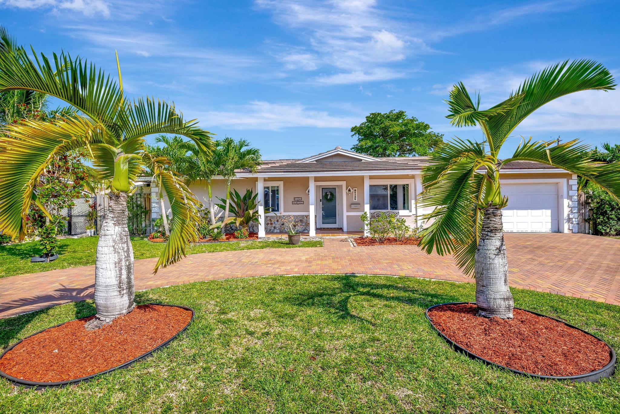 Beautiful corner-lot home offers spacious indoor and outdoor living, with added privacy & fully fenced yard. The master bedroom opens to a cabana bath leading to a sparkling pool, surrounded by palms and a travertine deck—perfect for relaxing/entertaining. Upgrades: Solar panels (2018), new roof (2022), screened enclosure (2025), impact windows, tankless water heater, AC (2021), brick paver driveway & irrigation system with a private well.
Centrally located near the Sawgrass Expressway, Turnpike, just 5 min from The Walk in Downtown Coral Springs, easy access to shops, dining, and a nearby hospital. Large driveway fits 6–8 vehicles—great for families or hosting. No HOA, excellent schools, pet-friendly and a potential assumable loan for Veterans, this home combines comfort and convenience