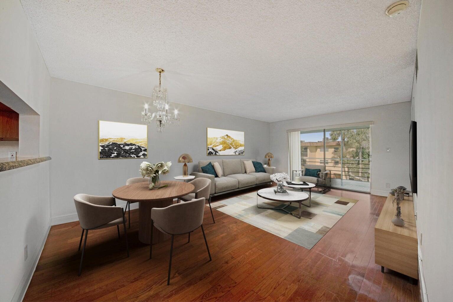 Step into this beautifully designed 2-bedroom, 2-bath condo, offering an open and airy floorplan perfect for modern living. The spacious living area features elegant wood flooring and a sliding glass door that leads to a screen-enclosed balcony, ideal for enjoying fresh air and relaxing views. The light-filled kitchen boasts granite countertops, a convenient snack bar, and plenty of cabinet space, making it perfect for cooking and entertaining. Retreat to the primary suite, complete with a walk-in closet and an en-suite bath featuring a walk-in shower. The second bedroom is equally inviting, and both bedrooms have been updated with brand-new carpeting for added comfort. This stunning condo combines style, functionality, and comforta"don't miss the chance to make it yours!