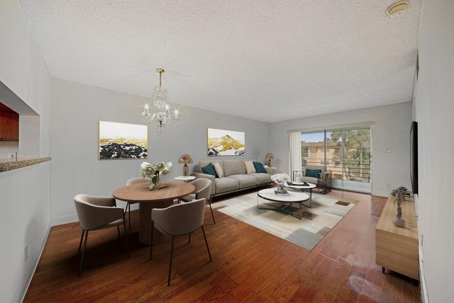Step into this beautifully designed 2-bedroom, 2-bath condo, offering an open and airy floorplan perfect for modern living. The spacious living area features elegant wood flooring and a sliding glass door that leads to a screen-enclosed balcony, ideal for enjoying fresh air and relaxing views. The light-filled kitchen boasts granite countertops, a convenient snack bar, and plenty of cabinet space, making it perfect for cooking and entertaining. Retreat to the primary suite, complete with a walk-in closet and an en-suite bath featuring a walk-in shower. The second bedroom is equally inviting, and both bedrooms have been updated with brand-new carpeting for added comfort. This stunning condo combines style, functionality, and comforta"don't miss the chance to make it yours!
