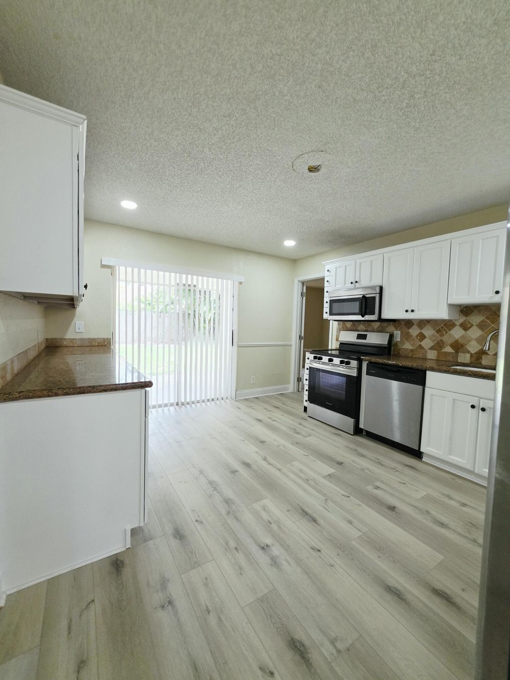 Photo of 5447 Twin Oakes Road, Greenacres, FL 33463 (MLS # B26048108)