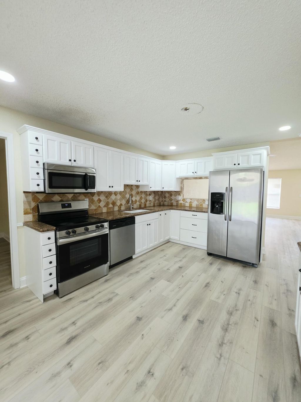 Photo of 5447 Twin Oakes Road, Greenacres, FL 33463 (MLS # B26048108)