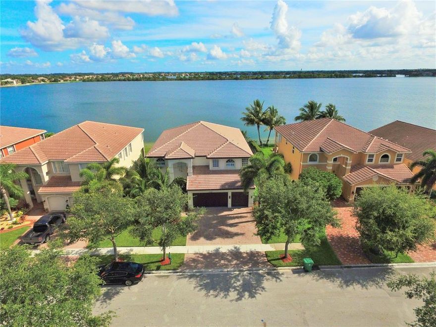 AMAZING PROPERTY COMPLETELY REMODELED WITH 6 BED/4BATH. SPECTACULAR 1 MILE LAKE VIEW FROM EVERY ANGLE OF THE HOUSE. NEW KITCHEN WITH CENTER ISLAND, WOOD CABINETS, QUARTZ COUNTERTOPS, SS APPLIANCES, NEW PORCELAIN AND WOOD FLOORS THROUGHOUT THE HOUSE, ALL BATHROOMS ARE NEW, NEW IRON STAIRCASE, NEW PLANTATION SHUTTERS, NEW BASEBOARS AND CROWN MOLDING, NEW WASHER AND DRYER, NEW A/C UNITS. NEW CALIFORNIA CLOSETS IN EVERY BEDROOM.