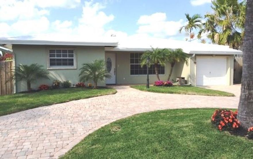 Charming, updated 3 bedroom. 2 bath Waterfront Pool home with no fixed bridges conveniently located just a few blocks east of Federal Hwy. Updated kitchen, bathrooms, and bedrooms with wood flooring. New 60 Ft dock with both 110 and 220 power. House is freshly painted with new sod and automatic digital sprinkler system. Remodeled 15x30 pool with diamond bright finish. Plenty of space for backyard fun, fishing and swimming. Conveniently located near shopping, beaches, restaurants and much more.