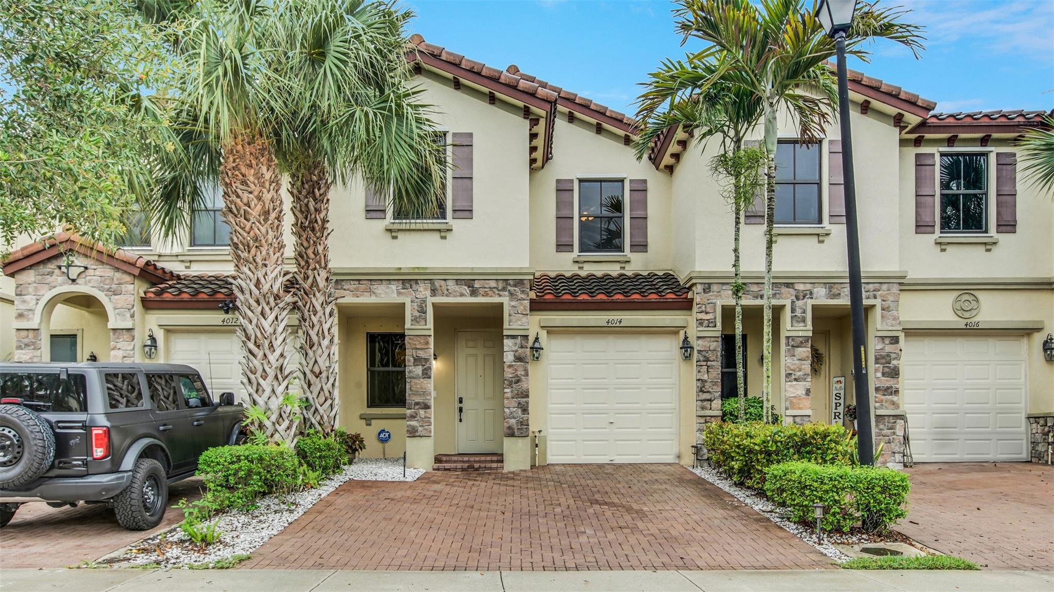 Move-In Ready, Modern Townhome with EV Charger & Upgrades Galore! Don’t miss this opportunity to own a stunning townhome in the boutique Ashton Parc community! Built in 2016 by Lennar, this gem checks every box—featuring wood-look tile & a new washer, dryer & microwave. Your upgraded kitchen has quartz countertops, stainless appliances & plenty of space to entertain. Enjoy a private patio with no rear neighbors, just peaceful nature views! The luxurious primary suite boasts a spacious walk-in closet & a spa-like bathroom with dual sinks, a large glass-enclosed shower & a separate water closet. This is a pet-friendly community with a sparkling pool, landscaping, tree trimming & roaming security, all for the lowest HOA around of $195/month! This is the one—schedule before it’s gone!