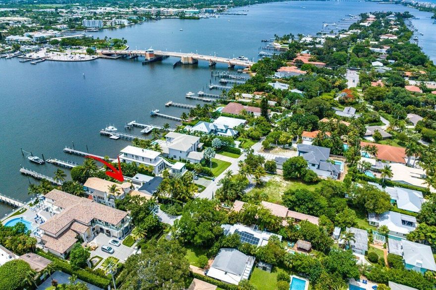 DIRECT INTRACOASTAL! Options Abound with This Waterfront Property on Upscale Hypoluxo Island.This fabulous waterfront location on private and secure Hypoluxo Island offers you the perfect opportunity to expand on the current design or build your dream home up to 5,000-sf. If you'd prefer, use the home as a winter getaway or a rental and investment property. The options are endless.This contemporary 2BR/2BA home with den features a fabulous open floor plan, vaulted ceilings, and porcelain floors caressed by soft natural light that comes through the large hurricane windows and doors that also provide spectacular pool and Intracoastal Waterway views.The kitchen features quartz countertops, stainless steel Viking appliances, and a center island with a gas range that includes
