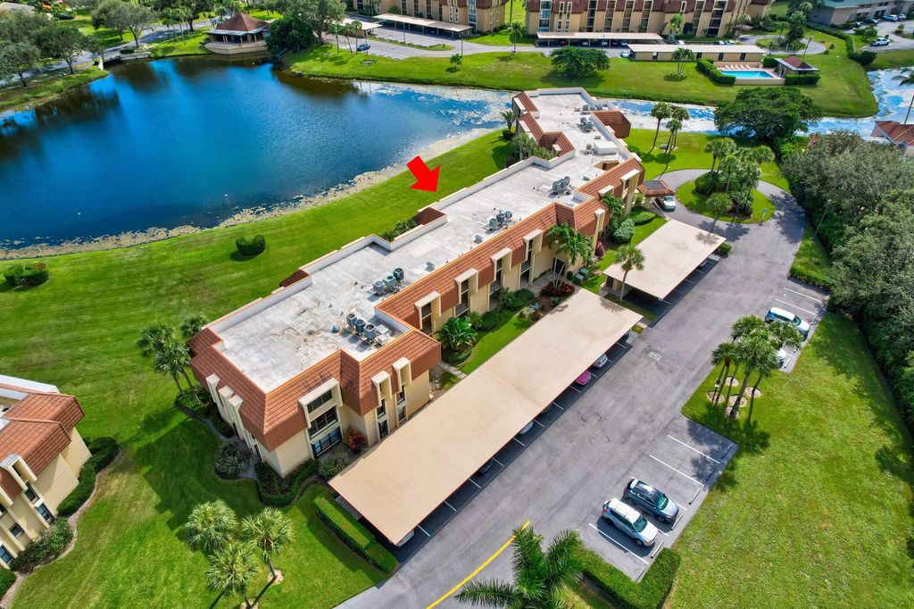 Photo of 5380 Woodland Lakes Drive #317, Palm Beach Gardens, FL 33418 (MLS # R10935752)