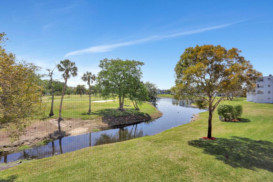 Model Condo-Step into this Stunning Corner 2-Bedroom 2-Bath Condo & Experience a Lifestyle you've been Searching for-Nestled in Margate's Sought After Active 55 Plus Community-Cable & Water Included-This Condo has Sweeping Golf Course & Tranquil Water Views Offering Relaxation & Sophistication-A Stylish Interior is Designed for both Comfort & Elegance, w/ Delightful Details. You'll Notice Unique Architectural Touches: Crown Moldings, Charming Farm Doors, & Custom Closets- Bonus Features include Impact Windows and Washer & Dryer. The Chef's Kitchen is the Heart of the Home, Featuring a Spacious Island, Chef's Pantry, & Stainless Steel Appliances-The Open-Concept Layout Flows Effortlessly, Perfect for Entertaining or Unwinding after a day on the Greens. Schedule your Private Showing Extra Storage in the Common Area Close to your Condo--Assigned Parking Right Near your Condo-Close to Shops & Restaurants!