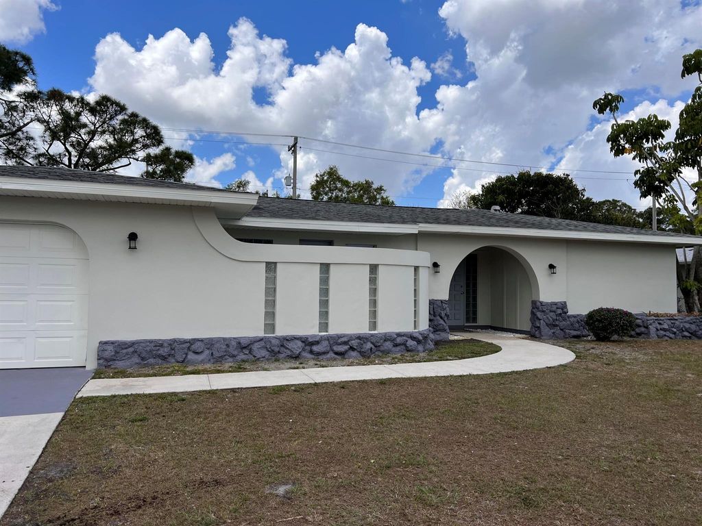 Photo of 118 NE Airoso Boulevard, Port St Lucie, FL 34983 (MLS # R10894547)